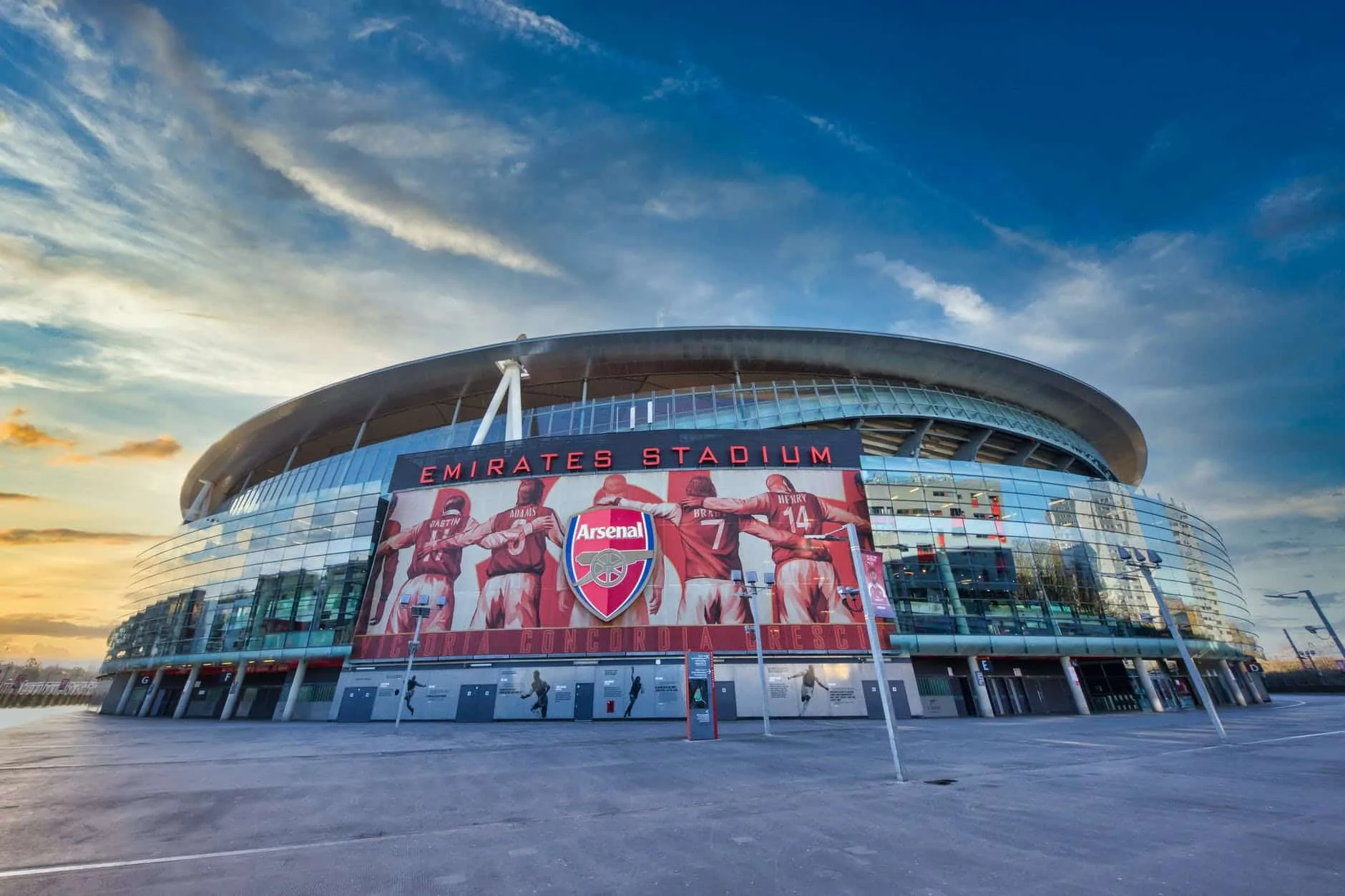 red and white stadium under blue sky