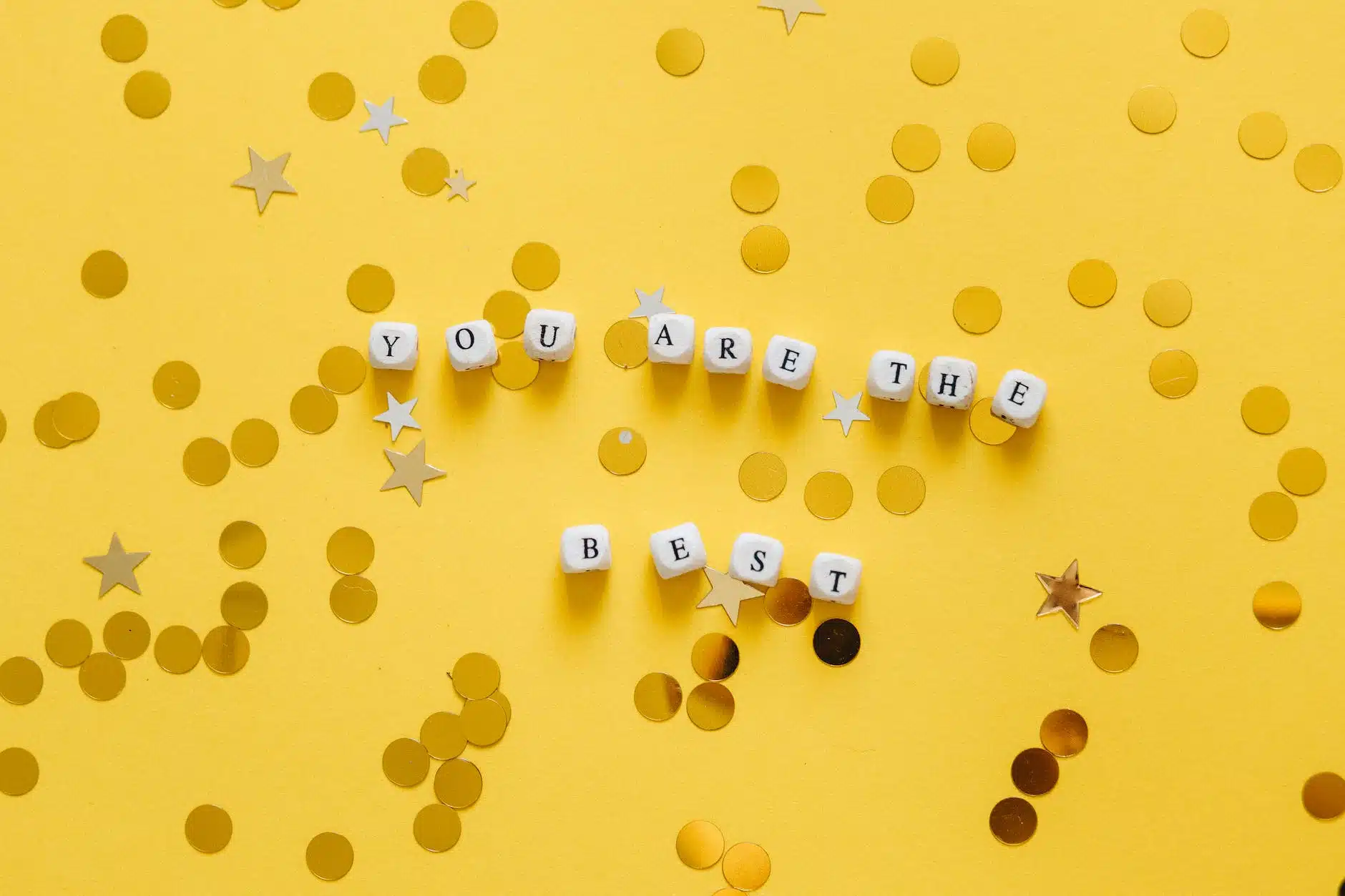 close up shot of dice on a yellow surface