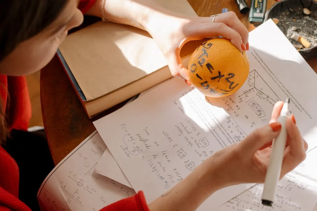 Person Holding Orange Round Ball