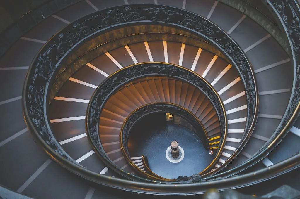 Intricate spiral staircase design in Vatican City offering a stunning architectural perspective.
